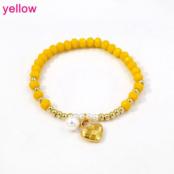 Pulsera elástica cristales amarillos dije corazón dorado