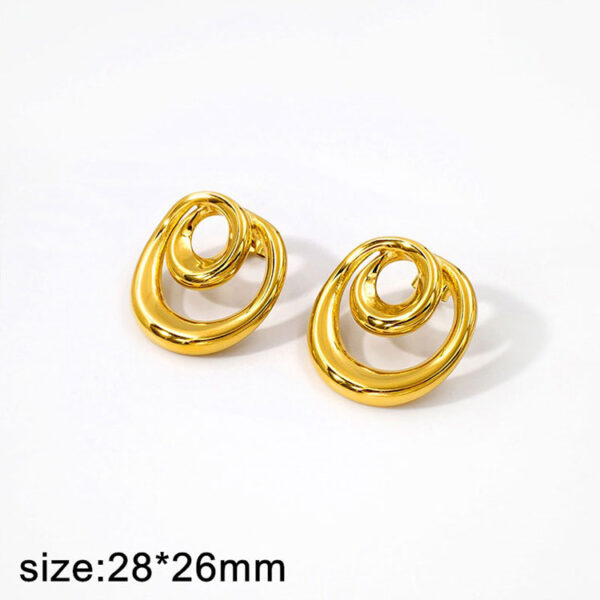 Aretes dorados diseños espiral 2.8cm