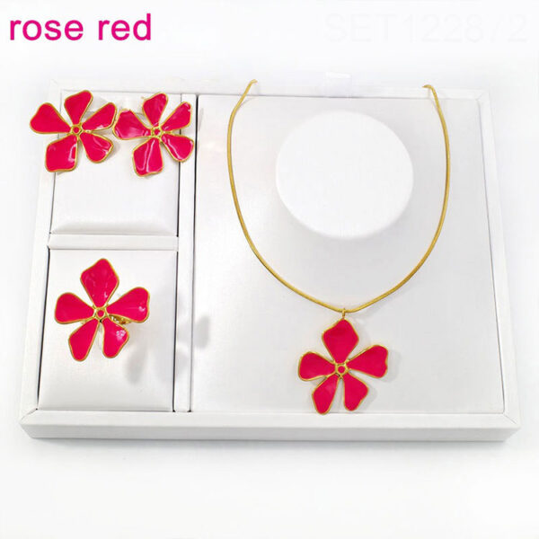 Set dorado flor grande color fucsia