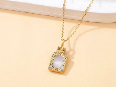 Collar dorado dije Perfume en nácar
