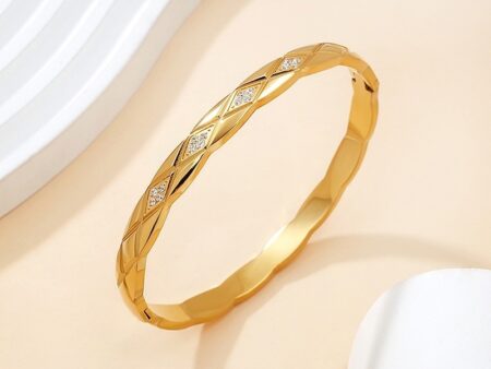 Brazalete dorado "Ch_nel" pedrería 6cm*6mm