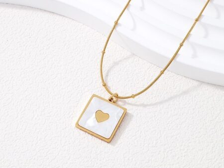 Collar dorado dije nácar corazoncito