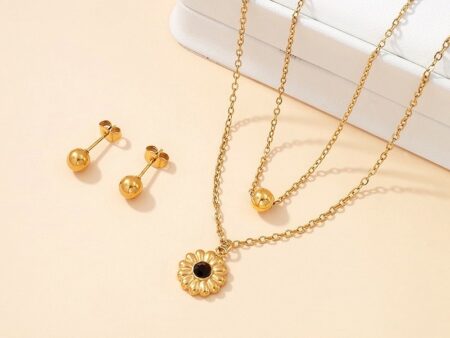 Set dorado collar doble dije flor