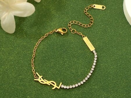 Pulsera dorada diseño YSL c/pedrería