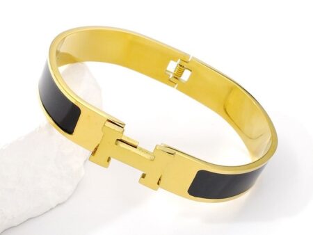 Brazalete dorado c/negro "HeRméS"