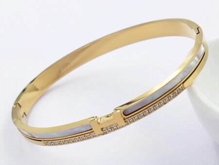 Brazalete dorado diseño H_rMés con pedrería