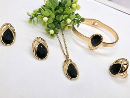 Set dorado 4 piezas piedra gota negra
