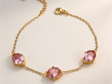 Pulsera dorada 3 piedras rosa