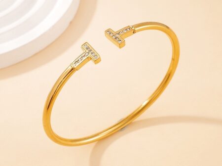 Brazalete dorado 5.8cm Diseño T