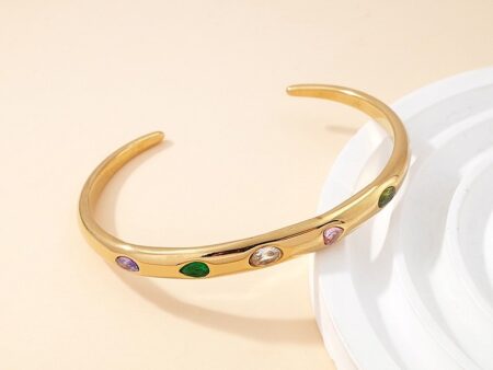 Brazalete dorado 6cm abierto pedrería colores