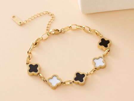 Pulsera dorada mini alhambras negro y blanco