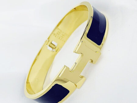 Brazalete dorado diseño H, con azul