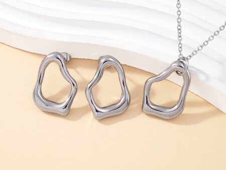 Set plateado Dije y aretes 2.6cm abstracto