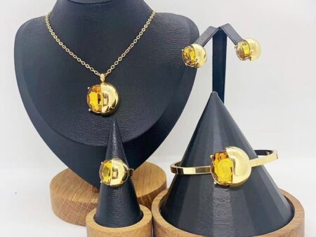 Set dorado 4 piezas piedra amarilla