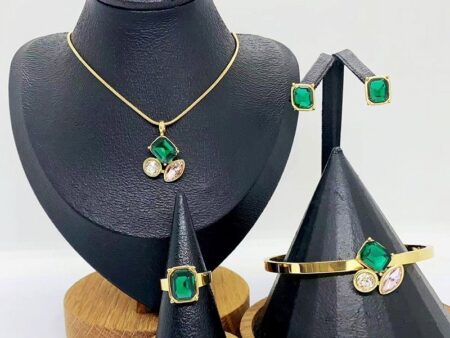 Set dorado 4 piezas piedra verde