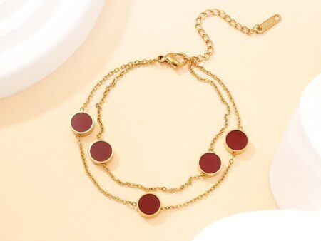 Pulsera dorada dijes rojos